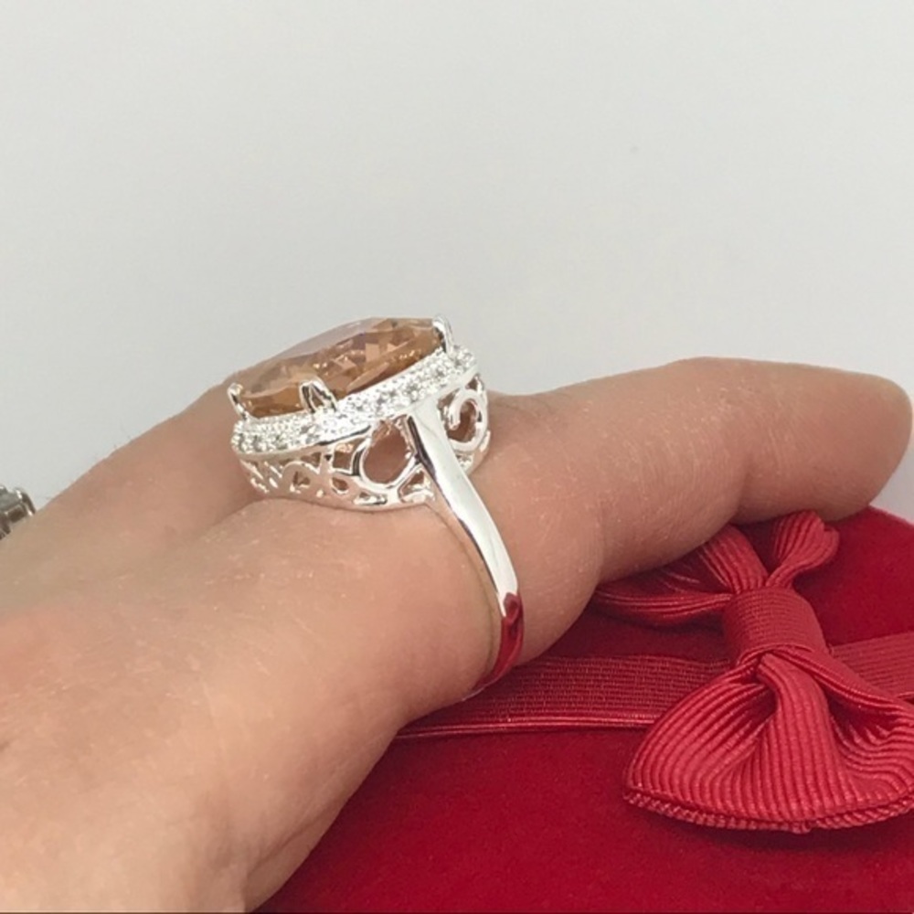 Pretty silver halo ring. peach cz white sa…